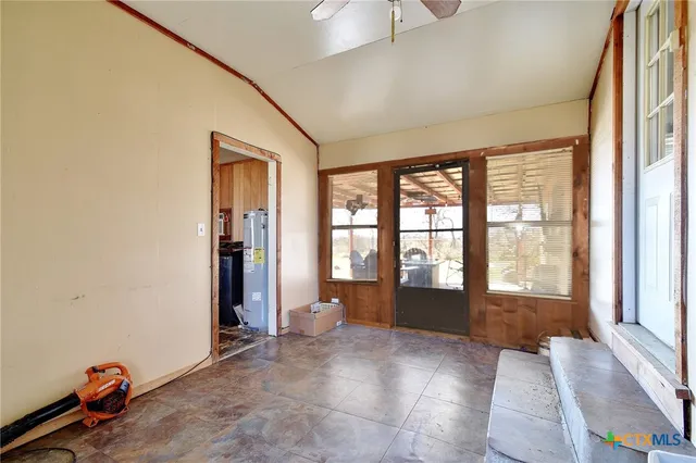 a view of an empty room and window