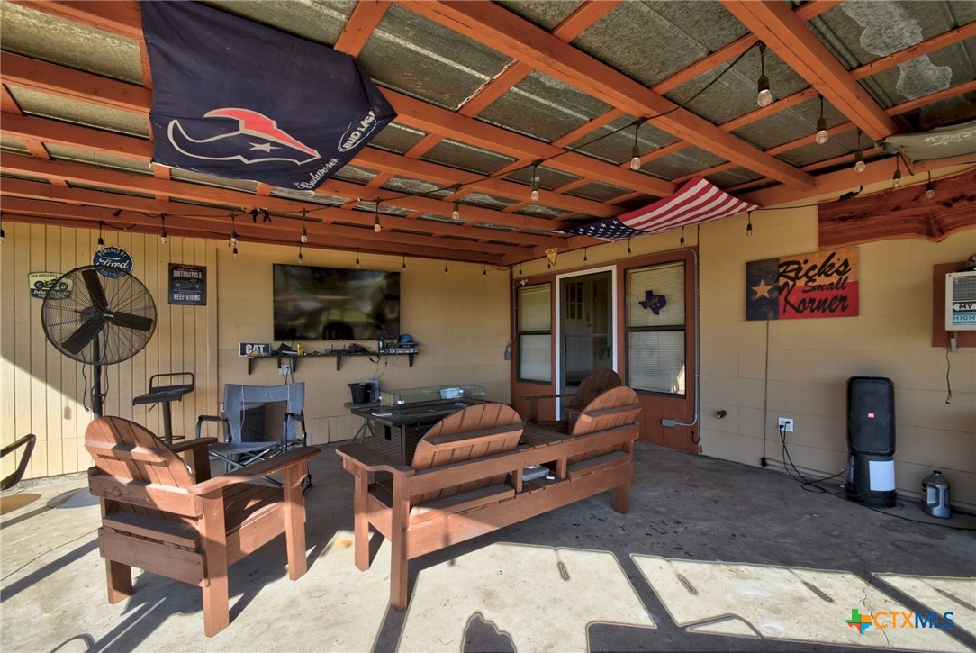 1017 Highway 87 Smiley, TX 78159 - Photo 23 of 30 a living room with furniture and a flat screen tv