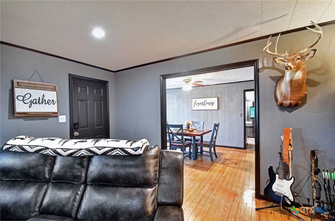 1017 Highway 87 Smiley, TX 78159 - Photo 7 of 30 a bedroom with furniture and wooden floor