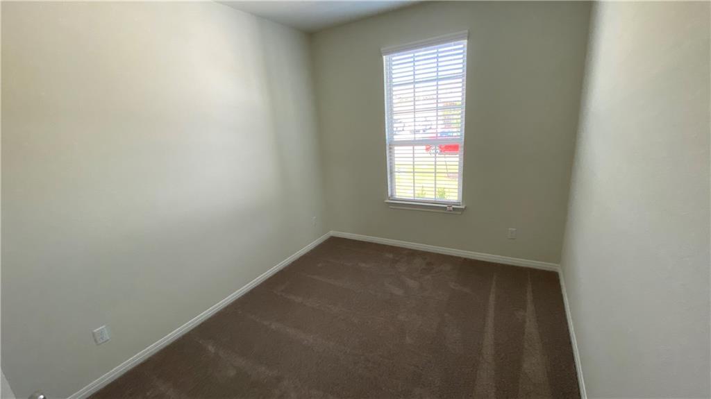 11805 Amber Stream Lane Manor, TX 78653 - Photo 6 of 10 an empty room with a window