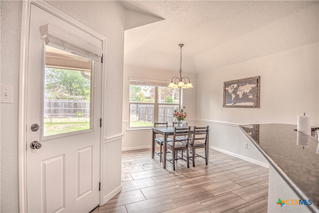 2520 Nolan Creek Street Temple, TX 76504 - Photo 11 of 32 a view of a dining room with furniture window and wooden floor
