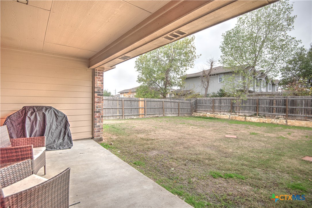 2520 Nolan Creek Street Temple, TX 76504 - Photo 26 of 32 a view of a backyard with a tub and wooden fence