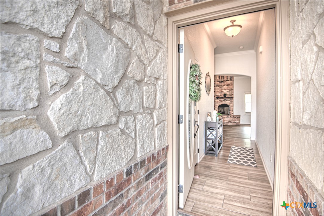 2520 Nolan Creek Street Temple, TX 76504 - Photo 5 of 32 a hallway with a white stove next to a window