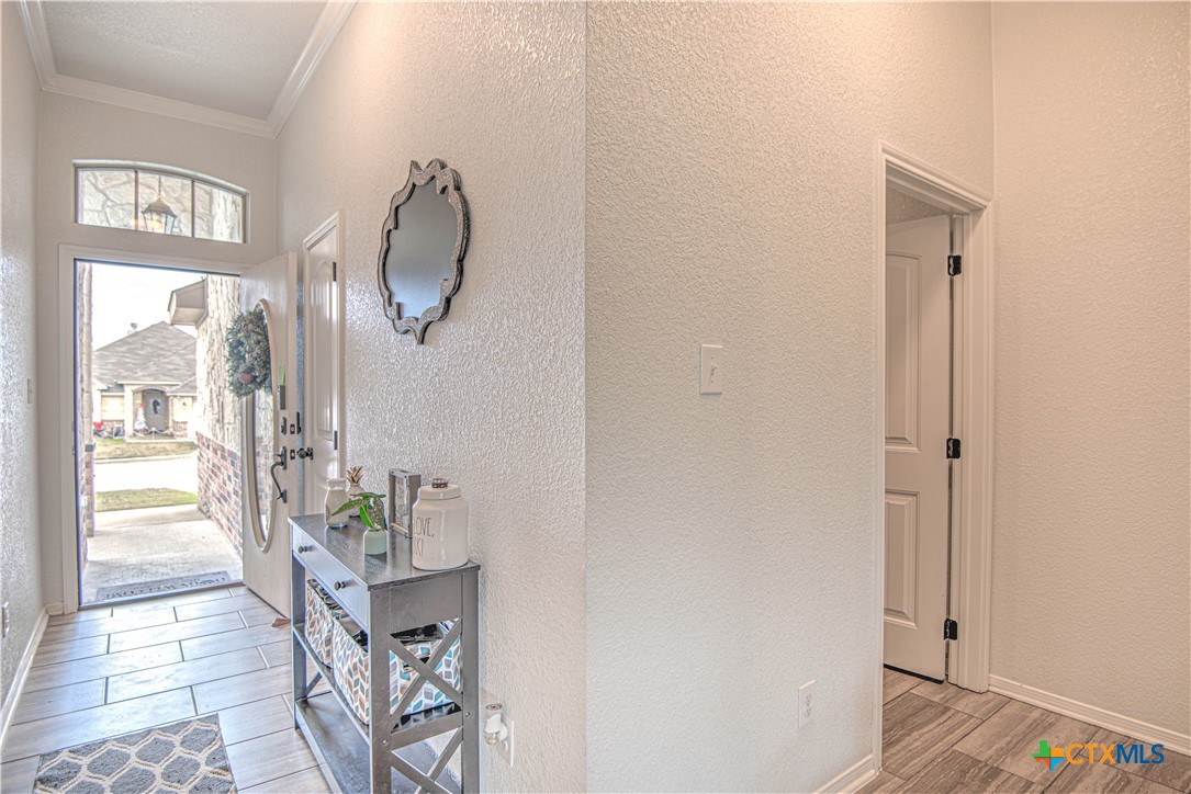 2520 Nolan Creek Street Temple, TX 76504 - Photo 6 of 32 a very nice looking room with a large window and wooden floor