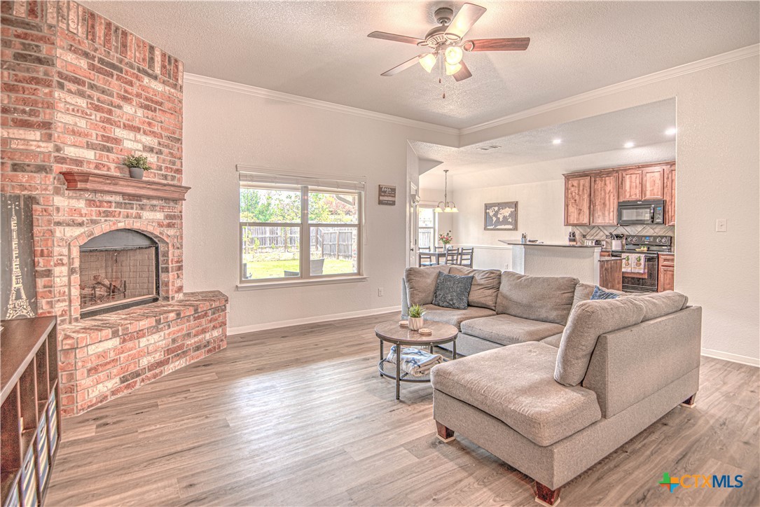 2520 Nolan Creek Street Temple, TX 76504 - Photo 7 of 32 a living room with furniture and a fireplace