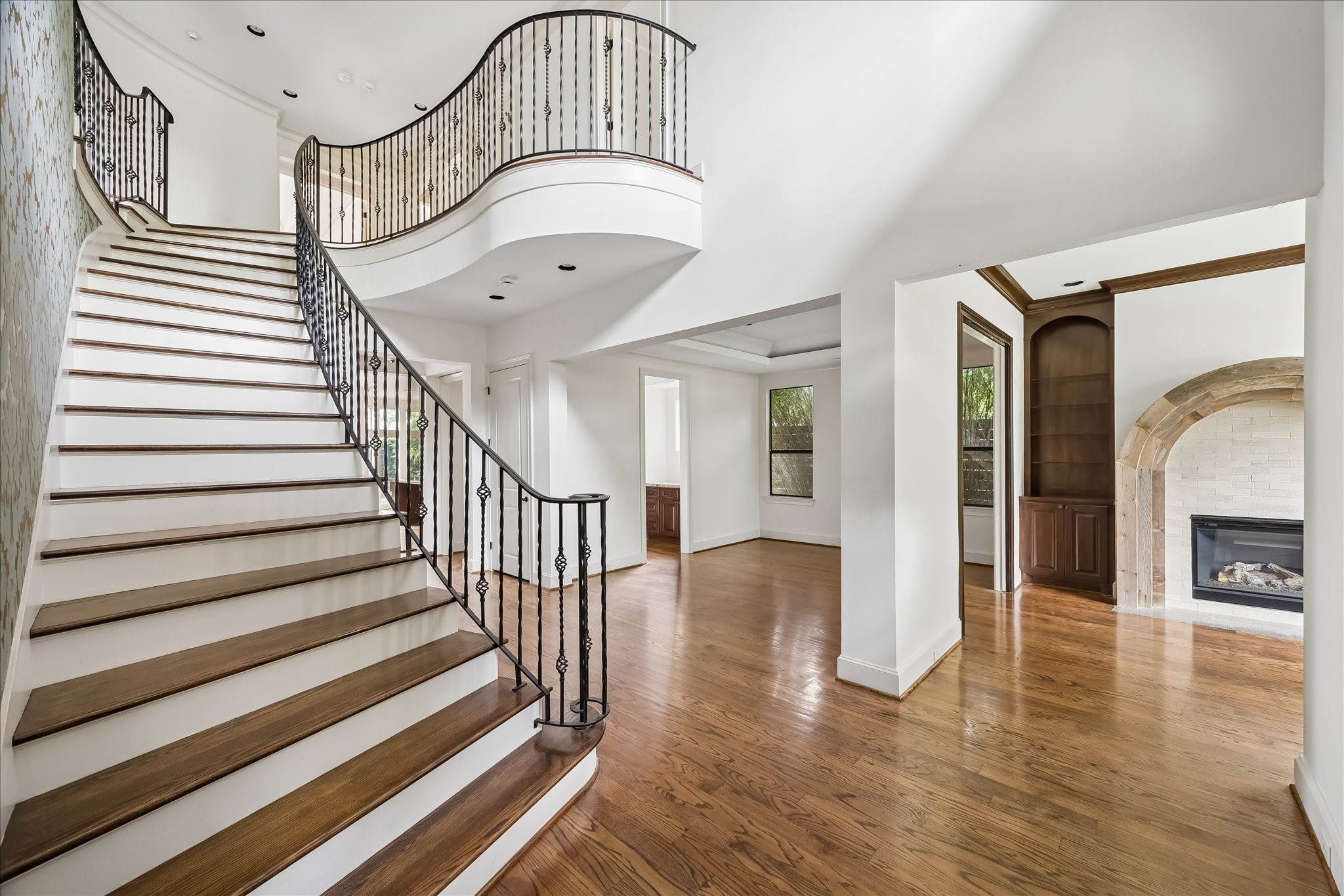 2246 Branard Street Houston, TX 77098 - Photo 4 of 40 Sweeping staircase and open sightlines create a dramatic introduction to the home’s main living spaces.
