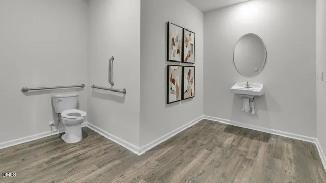 a bathroom with a toilet and a mirror