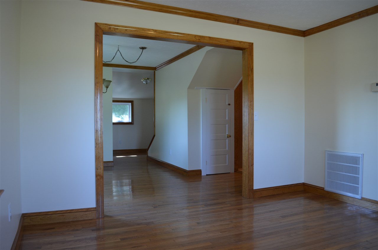 380 Mt Solon Road Mount Solon, VA 22843 - Photo 18 of 50 a view of an empty room with wooden floor and a window