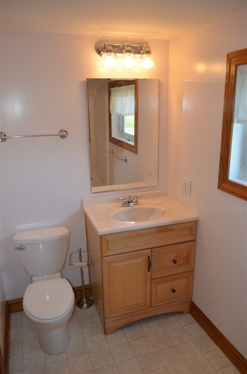 380 Mt Solon Road Mount Solon, VA 22843 - Photo 23 of 50 a bathroom with a toilet sink and mirror