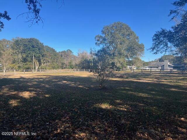 312 East Market Road Starke, FL 32091 - Photo 14 of 51 a view of dirt yard with a large tree
