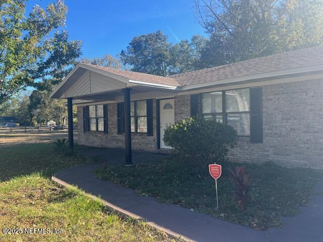 312 East Market Road Starke, FL 32091 - Photo 15 of 51 a view of a house with a backyard