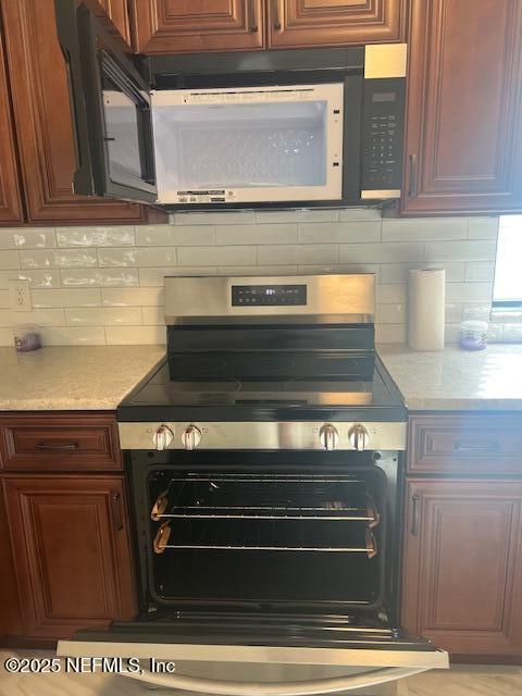 312 East Market Road Starke, FL 32091 - Photo 28 of 51 a stove top oven sitting inside of a kitchen