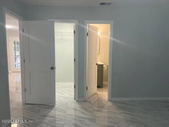 a view of an empty walk in closet