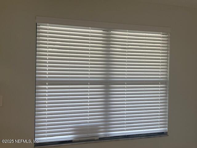 312 East Market Road Starke, FL 32091 - Photo 34 of 51 a view of a room with a white wooden floor and a window