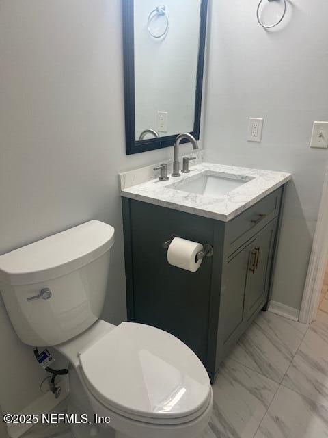 312 East Market Road Starke, FL 32091 - Photo 43 of 51 a bathroom with a toilet sink and mirror