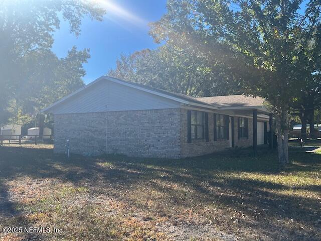 312 East Market Road Starke, FL 32091 - Photo 10 of 51 a view of a house with a yard