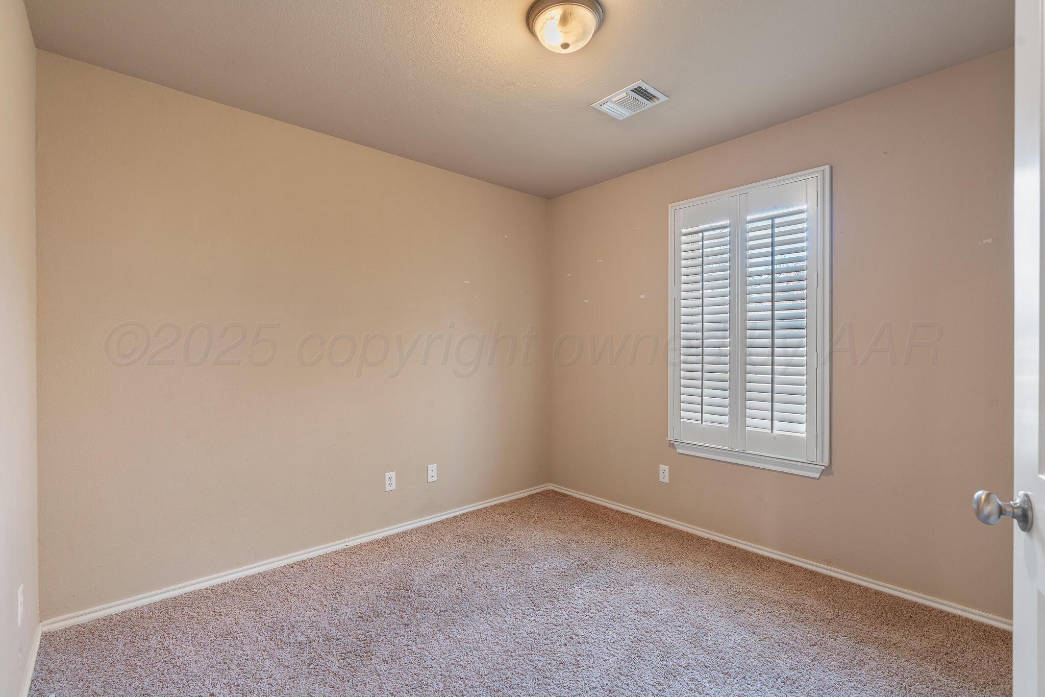4403 Ross Street Amarillo, TX 79118 - Photo 18 of 27 an empty room with a window