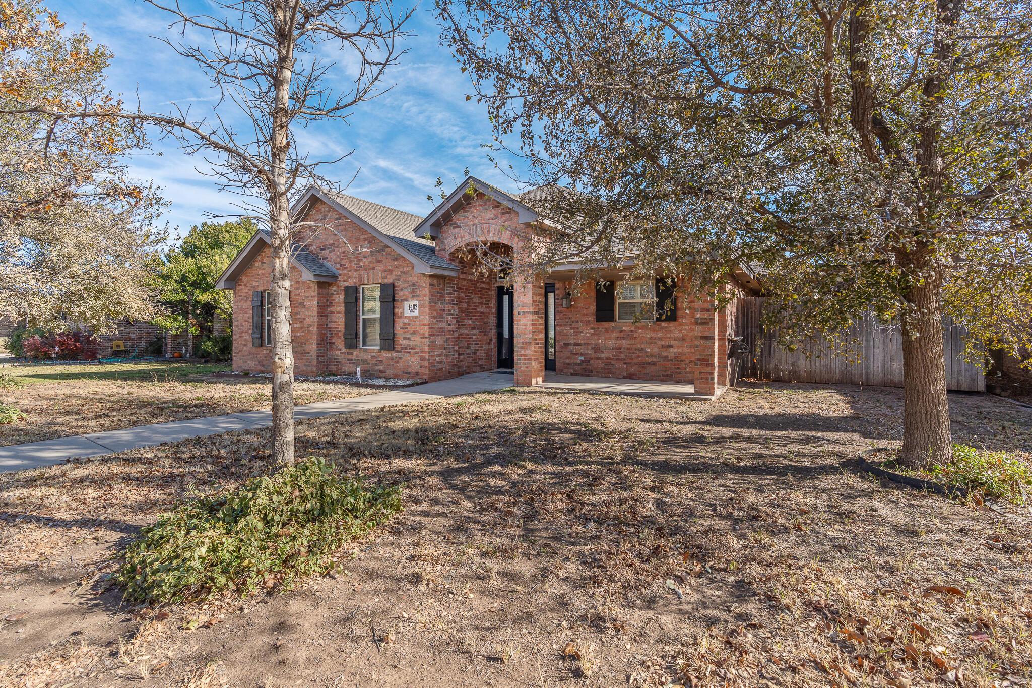 4403 Ross Street Amarillo, TX 79118 - Photo 3 of 27 a house that has a tree in front of it