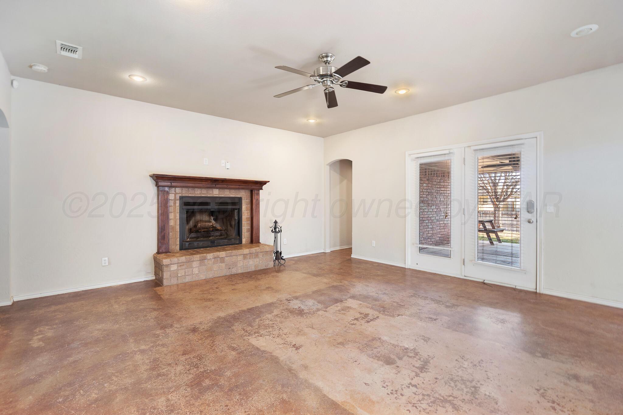 4403 Ross Street Amarillo, TX 79118 - Photo 8 of 27 a view of an empty room with a fireplace