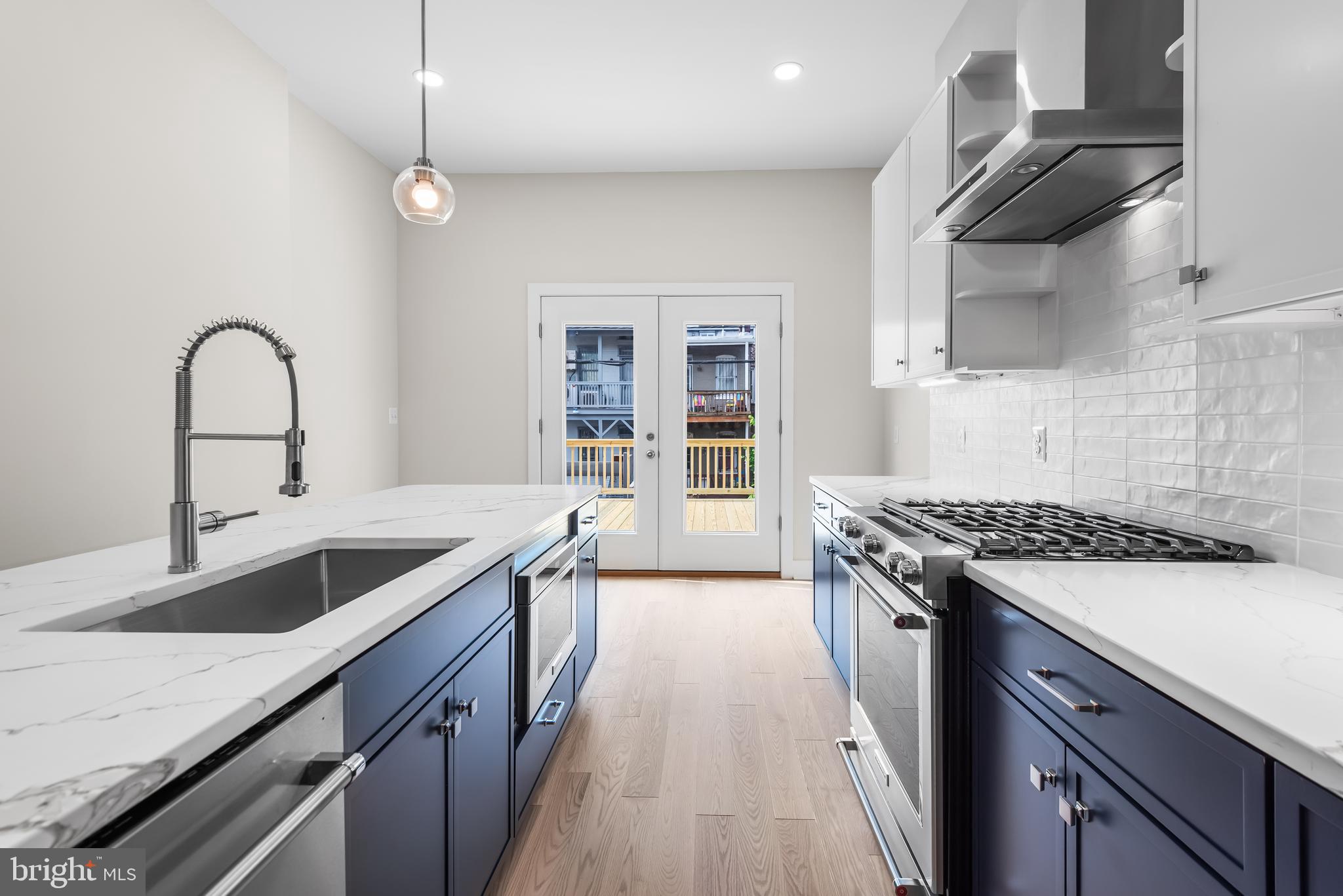 20 T Street Northwest, Unit 2 Washington, DC 20001 - Photo 13 of 31 a kitchen with a sink and a stove top oven