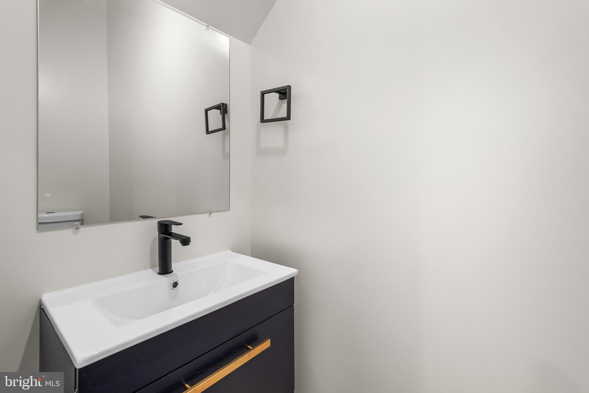 20 T Street Northwest, Unit 2 Washington, DC 20001 - Photo 16 of 31 a bathroom with a sink and a mirror