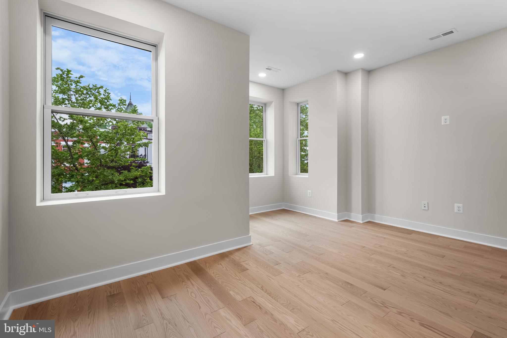 20 T Street Northwest, Unit 2 Washington, DC 20001 - Photo 21 of 31 a view of an empty room with wooden floor and a window