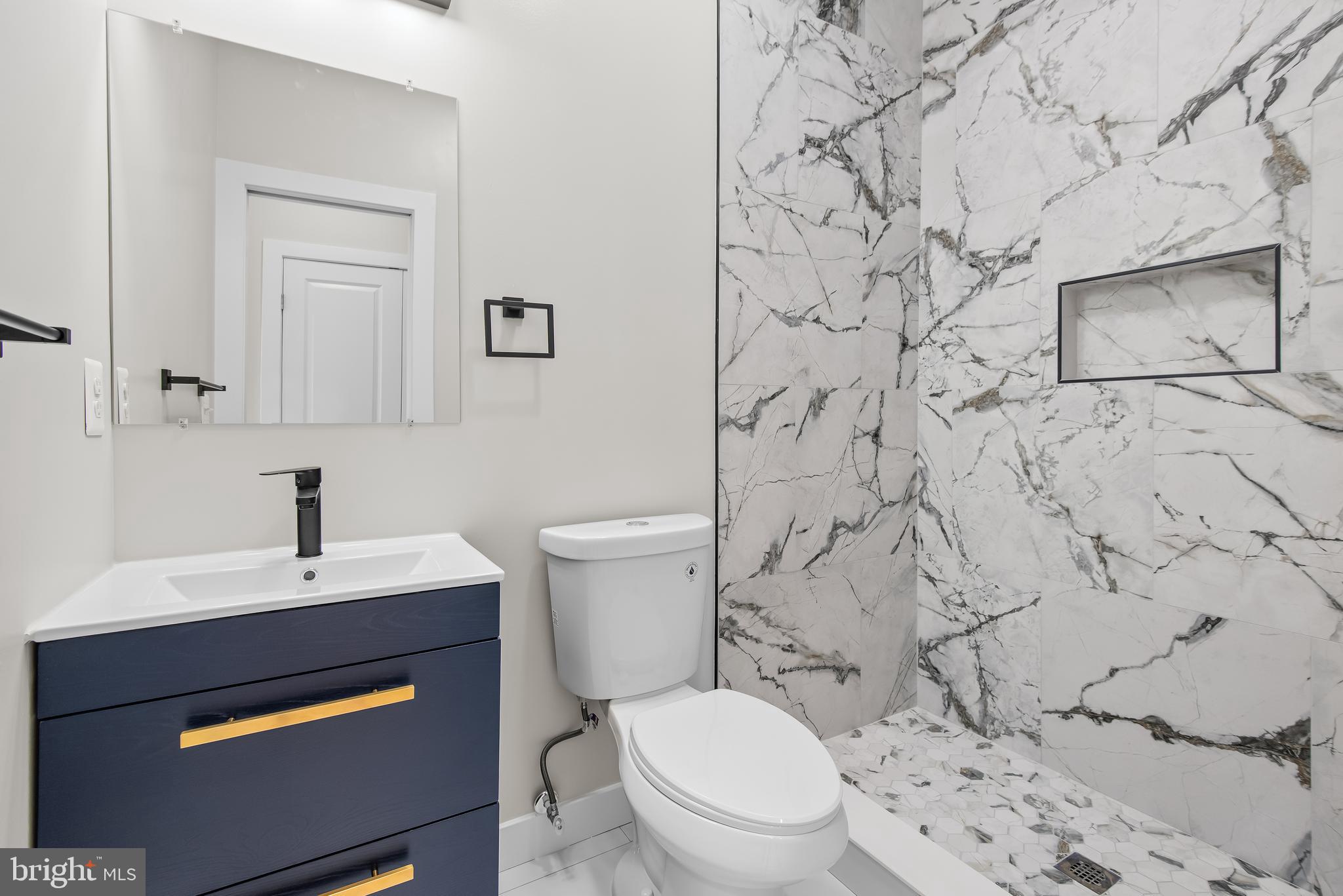 20 T Street Northwest, Unit 2 Washington, DC 20001 - Photo 25 of 31 a bathroom with a toilet sink and mirror