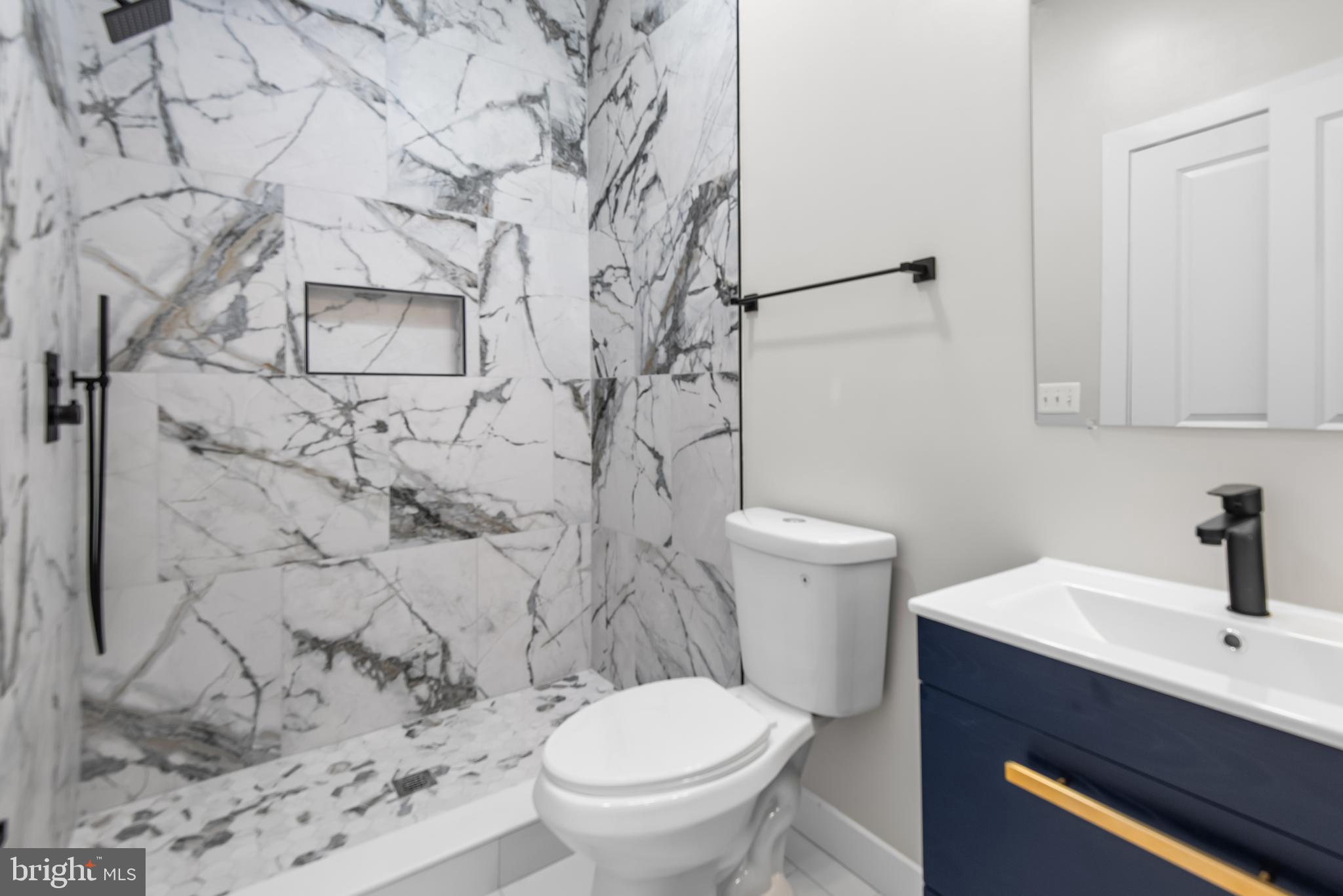 20 T Street Northwest, Unit 2 Washington, DC 20001 - Photo 27 of 31 a bathroom with a toilet and a sink