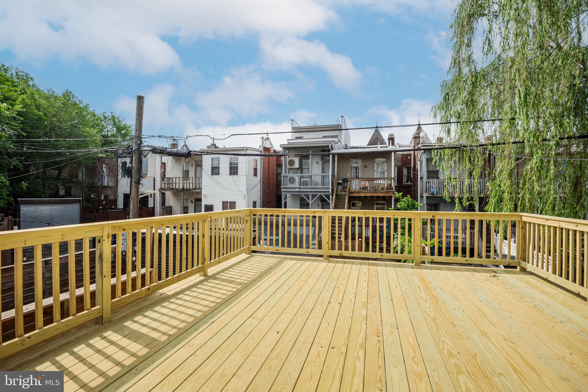 20 T Street Northwest, Unit 2 Washington, DC 20001 - Photo 30 of 31 a view of a wooden deck and city view
