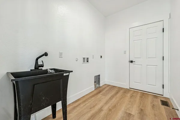 a view of a utility room with a sink