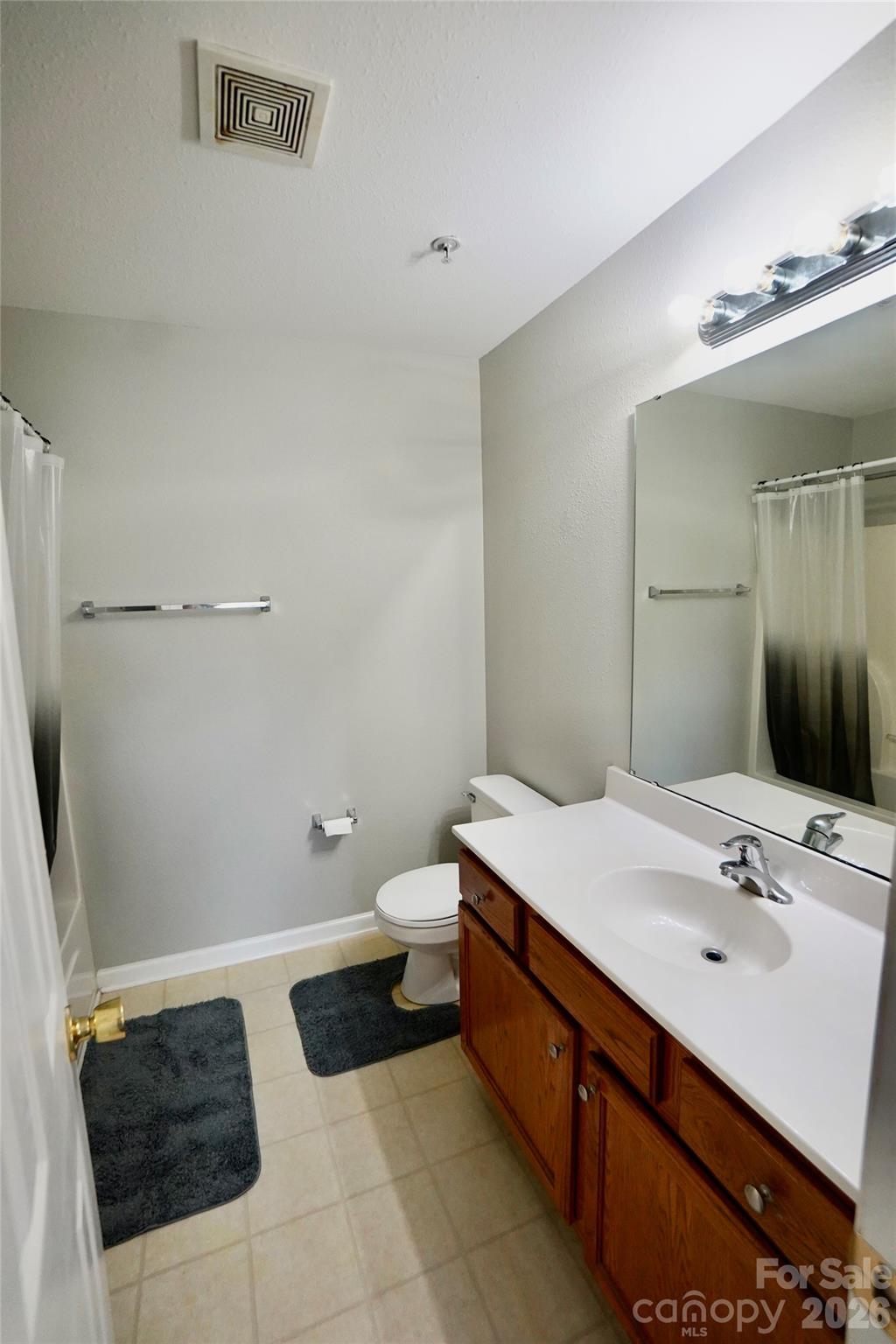 4010 Town Center Road Harrisburg, NC 28075 - Photo 8 of 17 a bathroom with a sink and mirror