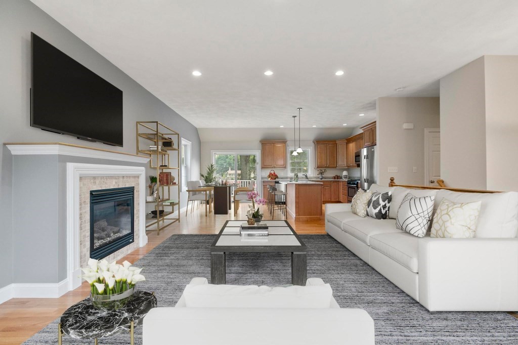 10 Emerald Court Stoneham, MA 02180 - Photo 13 of 42 a living room with furniture fireplace and flat screen tv