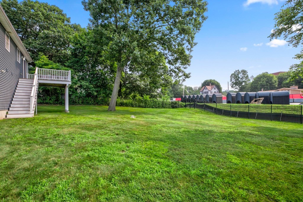10 Emerald Court Stoneham, MA 02180 - Photo 22 of 42 a view of a house with a yard