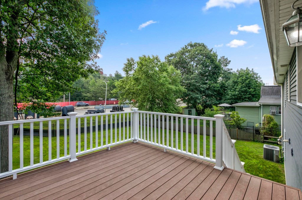10 Emerald Court Stoneham, MA 02180 - Photo 23 of 42 a view of a deck with a yard