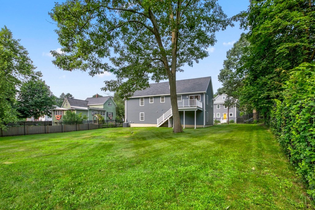 10 Emerald Court Stoneham, MA 02180 - Photo 24 of 42 a view of an house with backyard space and balcony