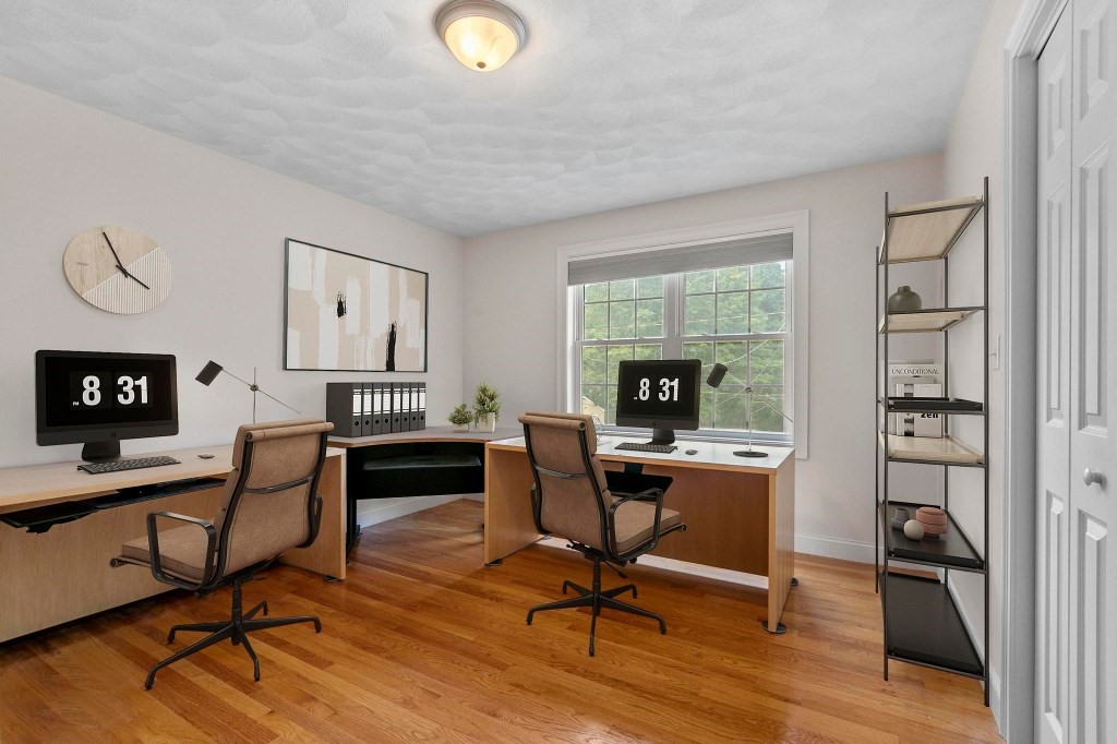 10 Emerald Court Stoneham, MA 02180 - Photo 27 of 42 a view of a workspace with furniture and a window