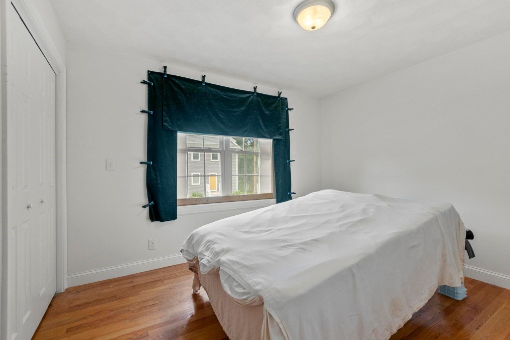 10 Emerald Court Stoneham, MA 02180 - Photo 30 of 42 a bedroom with a bed and a window