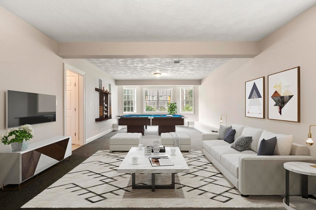 10 Emerald Court Stoneham, MA 02180 - Photo 38 of 42 a living room with furniture a large window and a flat screen tv