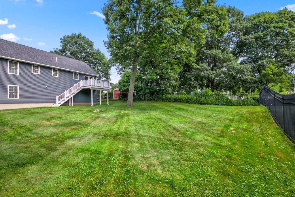 10 Emerald Court Stoneham, MA 02180 - Photo 42 of 42 a view of a house with a backyard