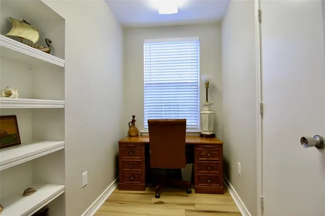 a view of a hallway with seating area