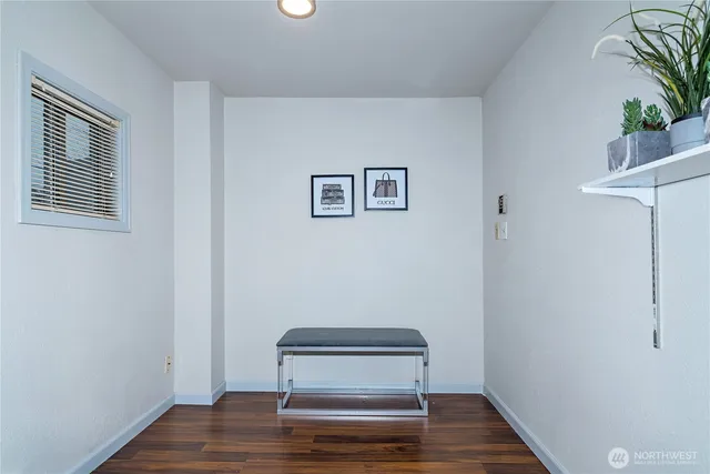 a view of wooden floor and chair in a room