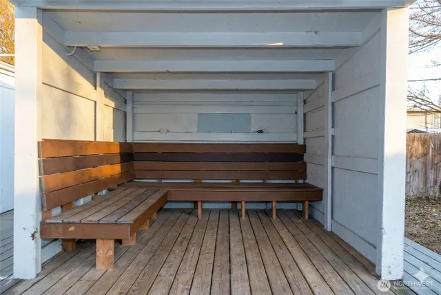 a view of outdoor space with wooden floor and stairs