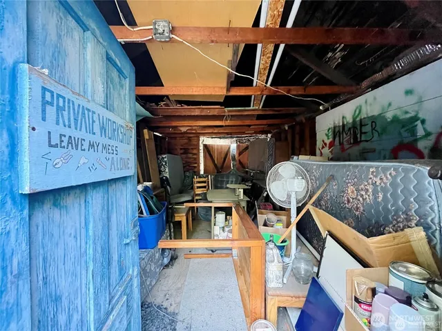 a view of living room with furniture and wooden floor
