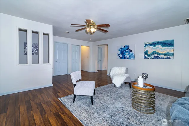 a bedroom with furniture and wooden floor