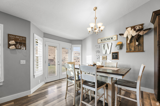 2056 West Ridgeline Road Stockton, UT 84071 - Photo 15 of 50 Dining area featuring wood-finish flooring and light gray walls