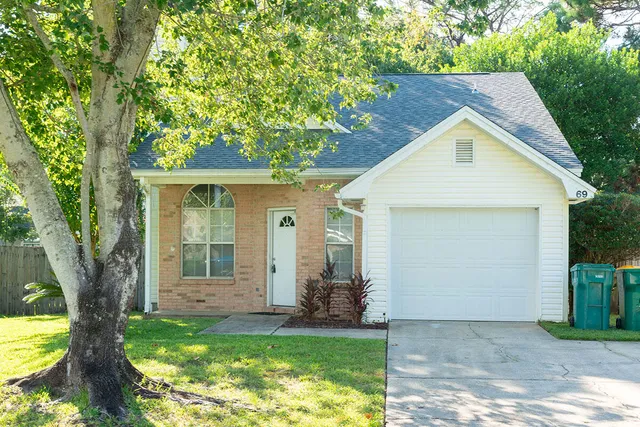 a view of a house with a yard