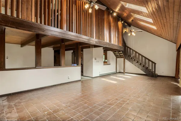 a view of an empty room with stairs