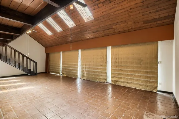 a view of an empty room with stairs