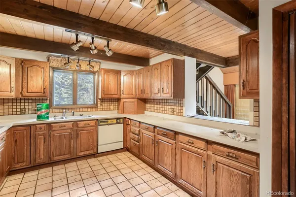 a large kitchen with a large window