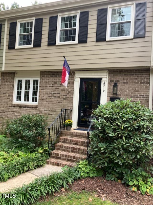 2919 Wycliff Road Raleigh, NC 27607 - Photo 1 of 24 a front view of a house with garden